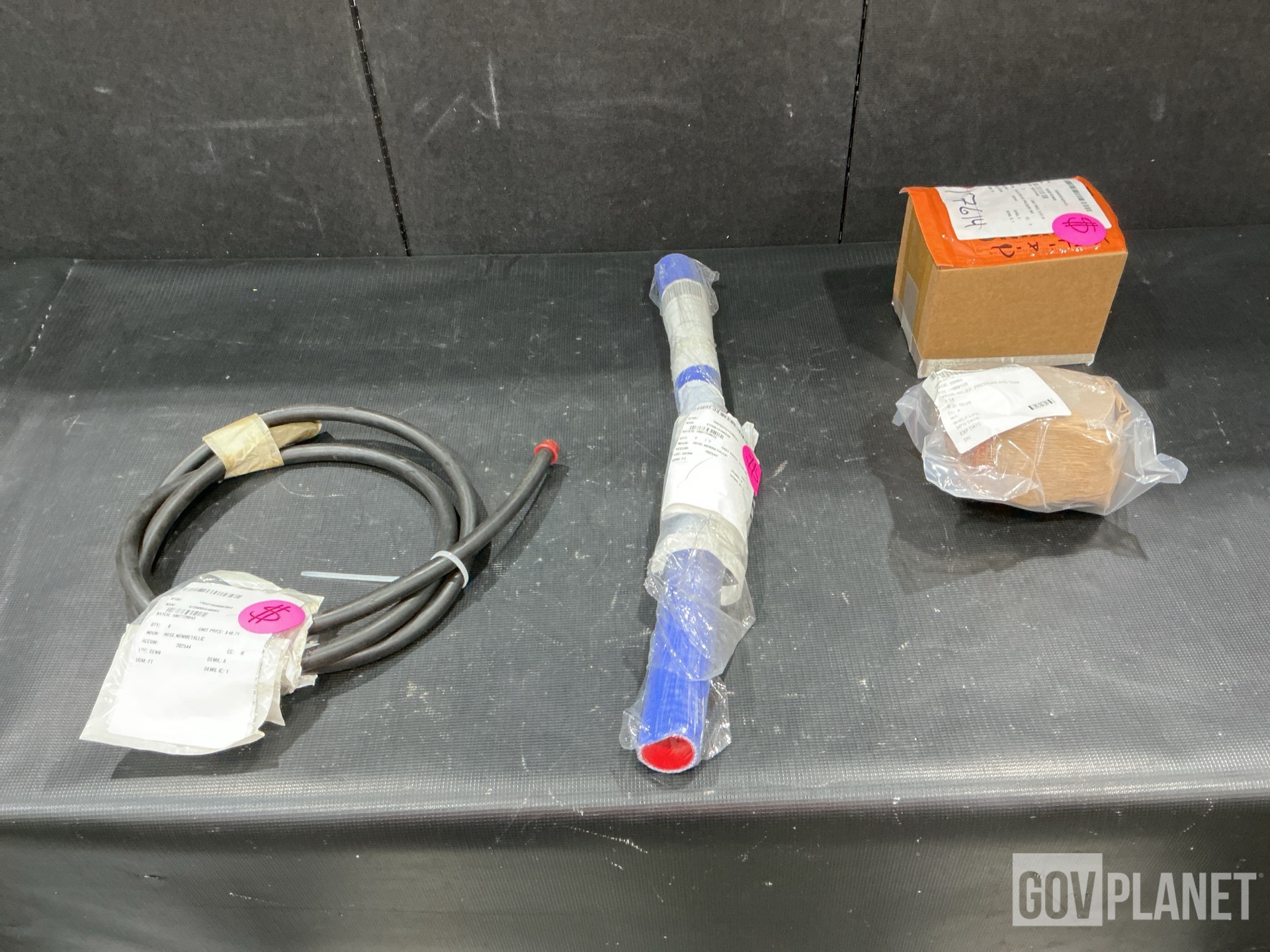 (15) Non-Metallic Hoses, (2) Relief Valves, (1) Tube Cap & Assorted Items