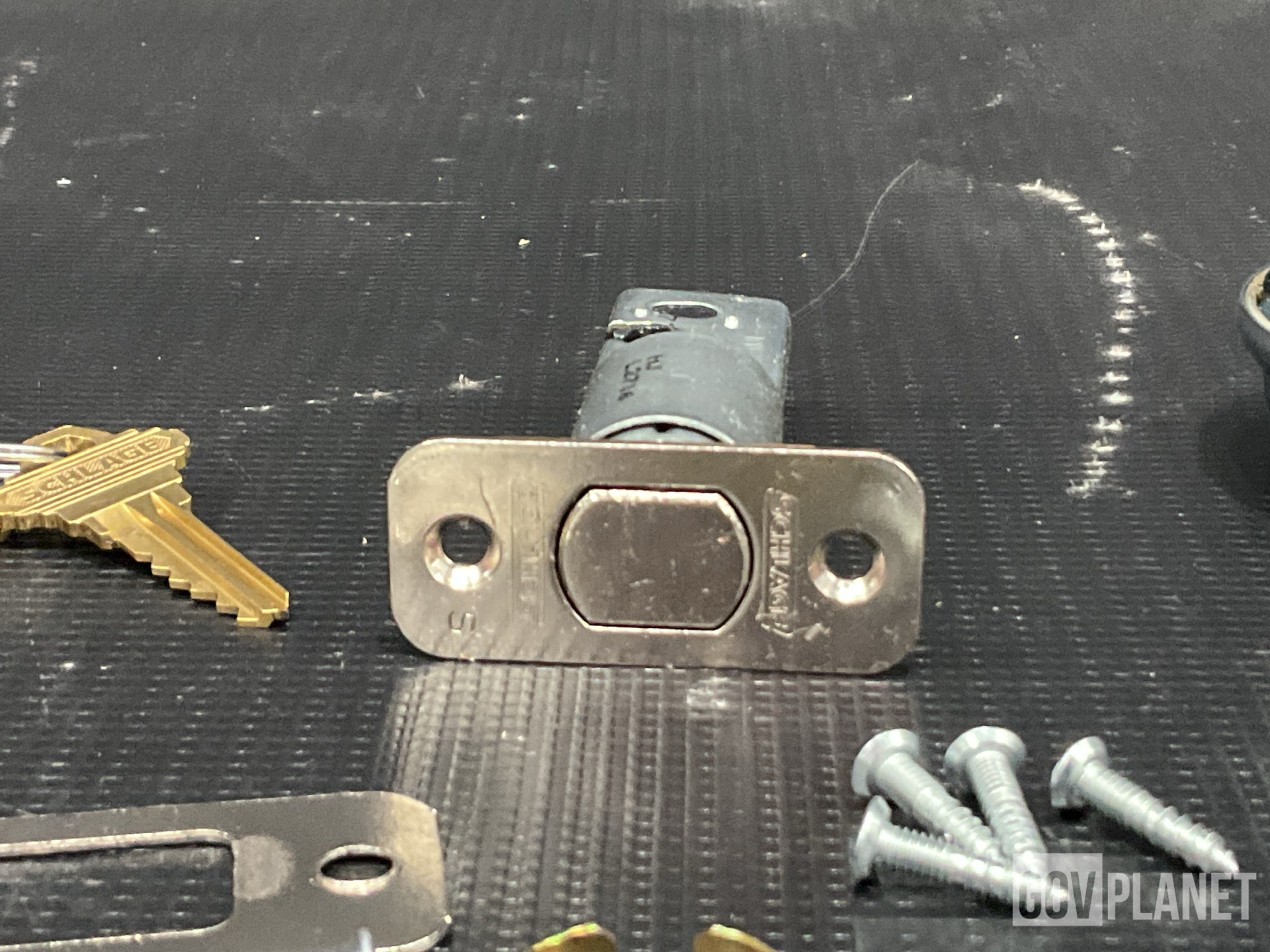 (31) Lock Sets, (37) Shear Bolts, (5) Webbing Straps & Assorted Items