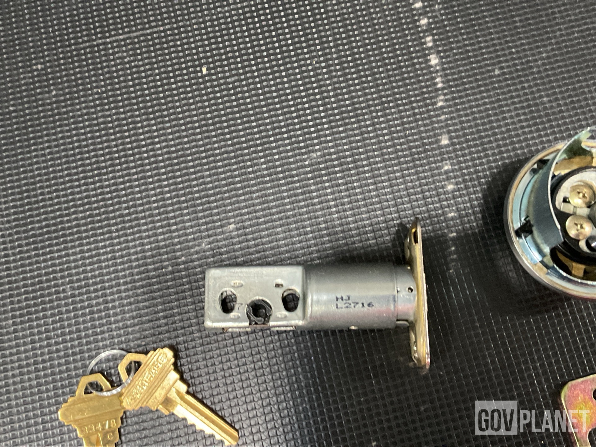 (31) Lock Sets, (37) Shear Bolts, (5) Webbing Straps & Assorted Items