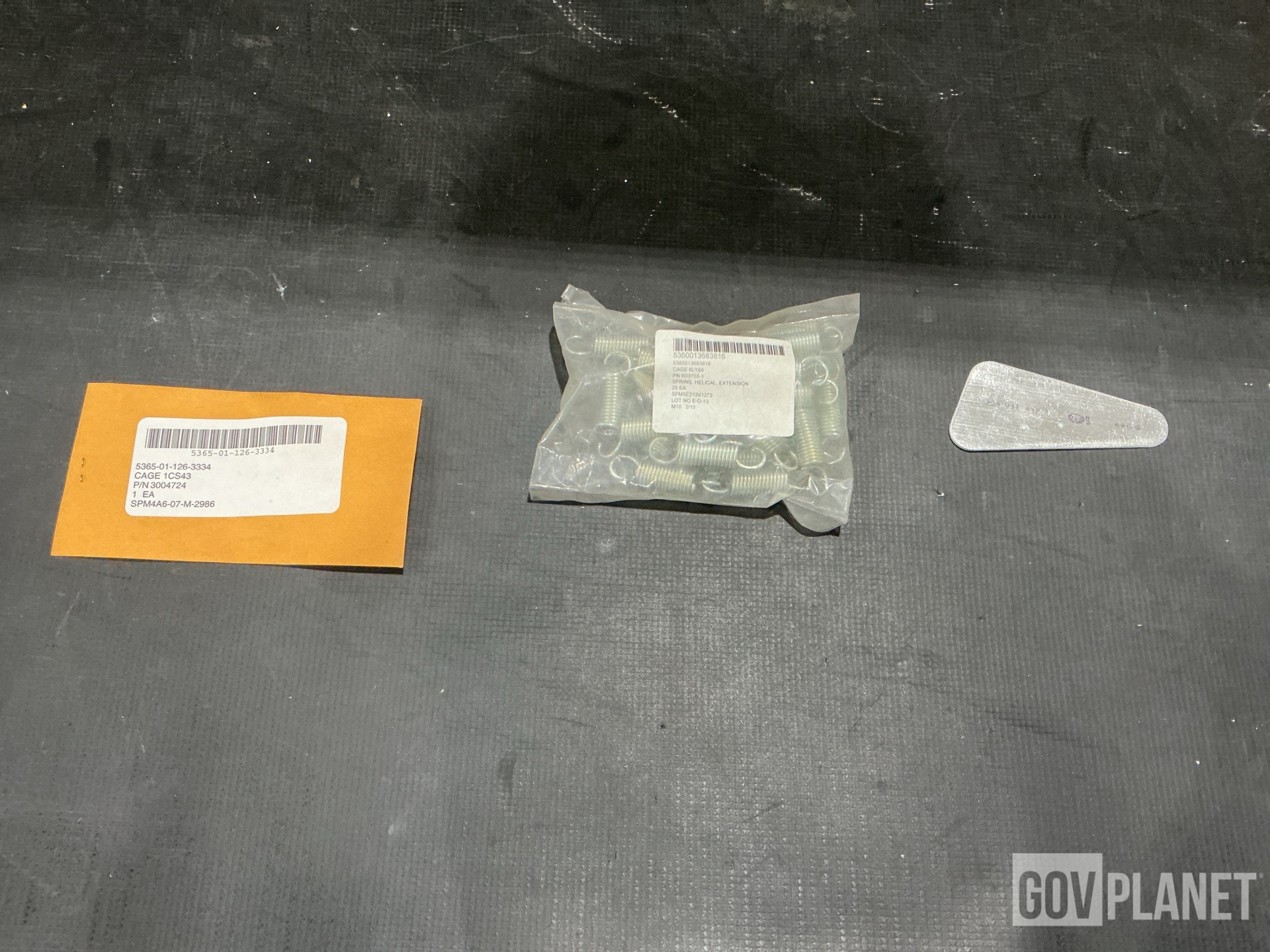 (132) Shims, (82) Extension Springs, (36) Spacers & Assorted Items