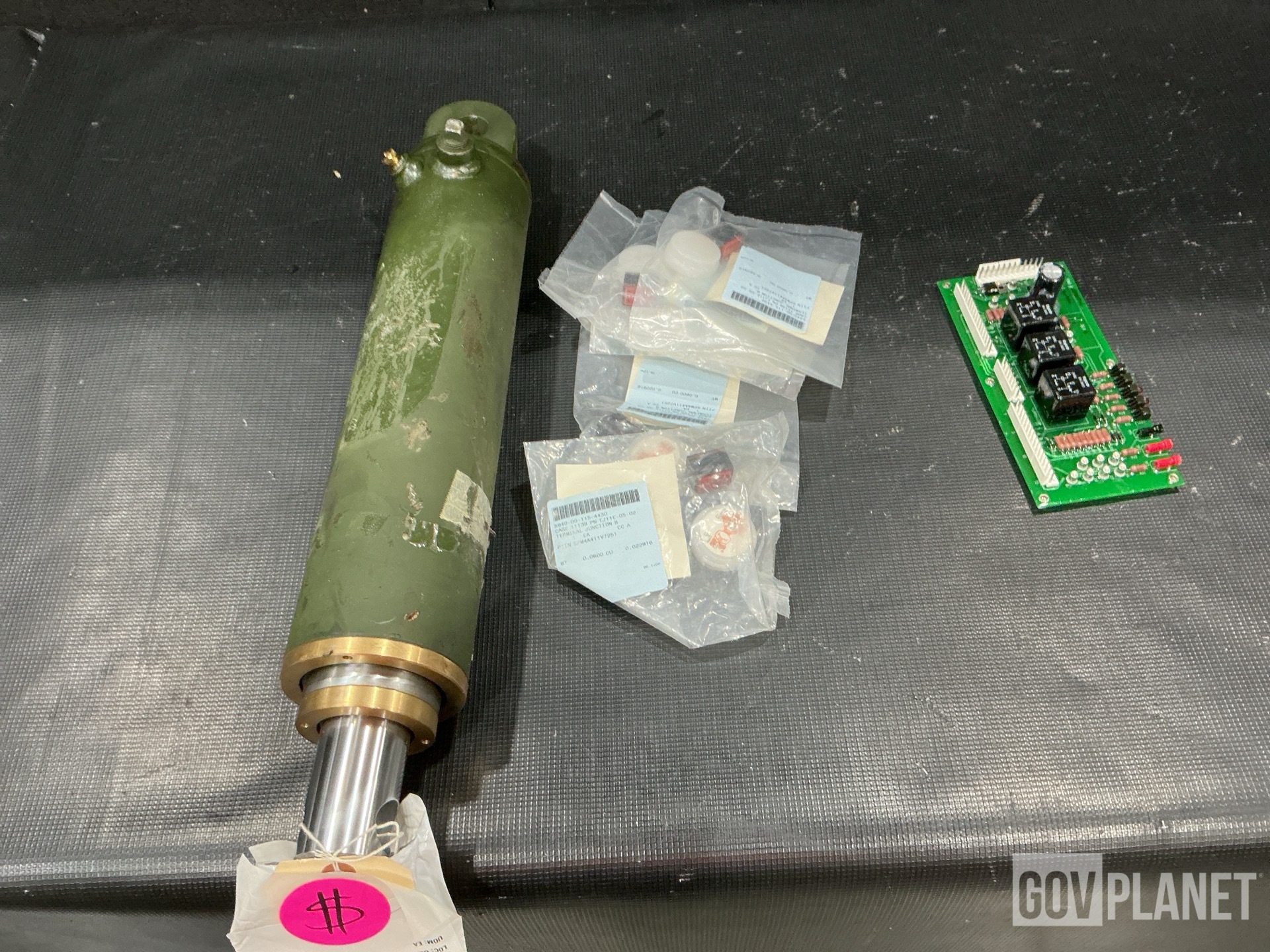 (1) Cylinder Assembly, (1) Circuit Card Assembly, (12) Modules & Assorted Items