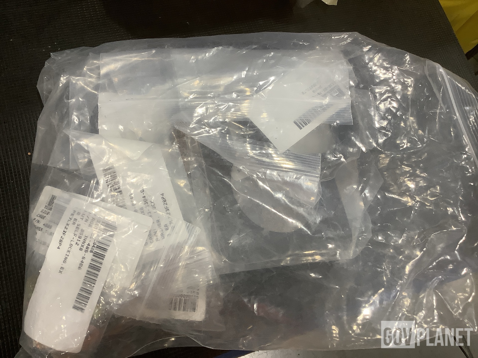 (1) Vehicular Maintenance Kit, (1) Mounting Plate & Assorted Items
