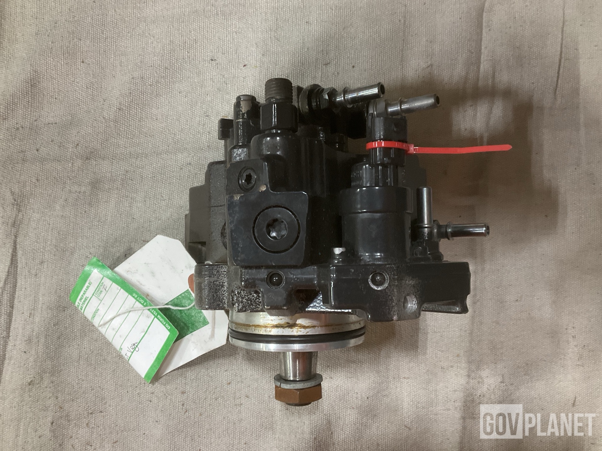 (1) Footrest, (1) Fuel Metering Pump & (18) Oil Filters & Assorted Items