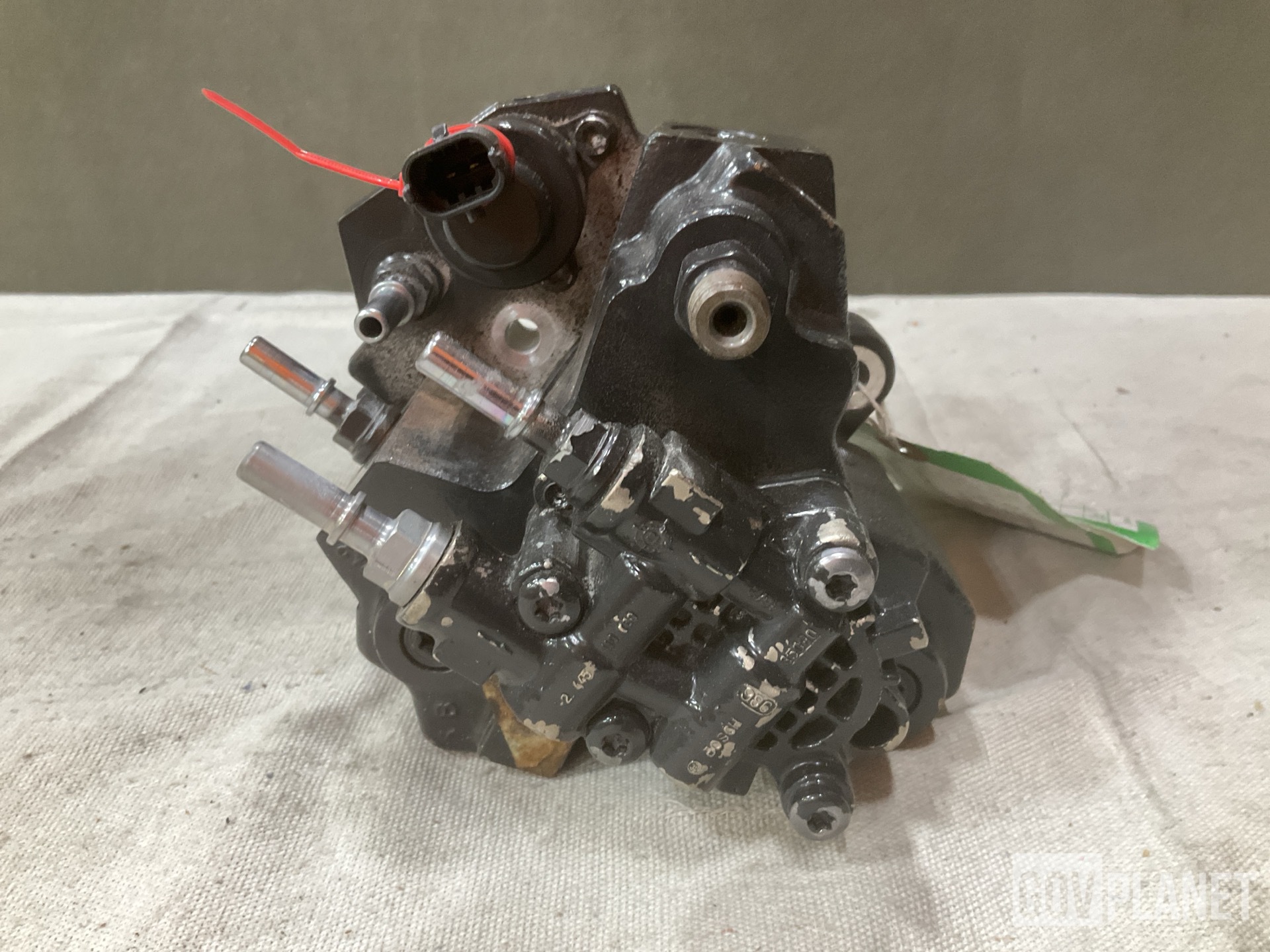 (1) Footrest, (1) Fuel Metering Pump & (18) Oil Filters & Assorted Items