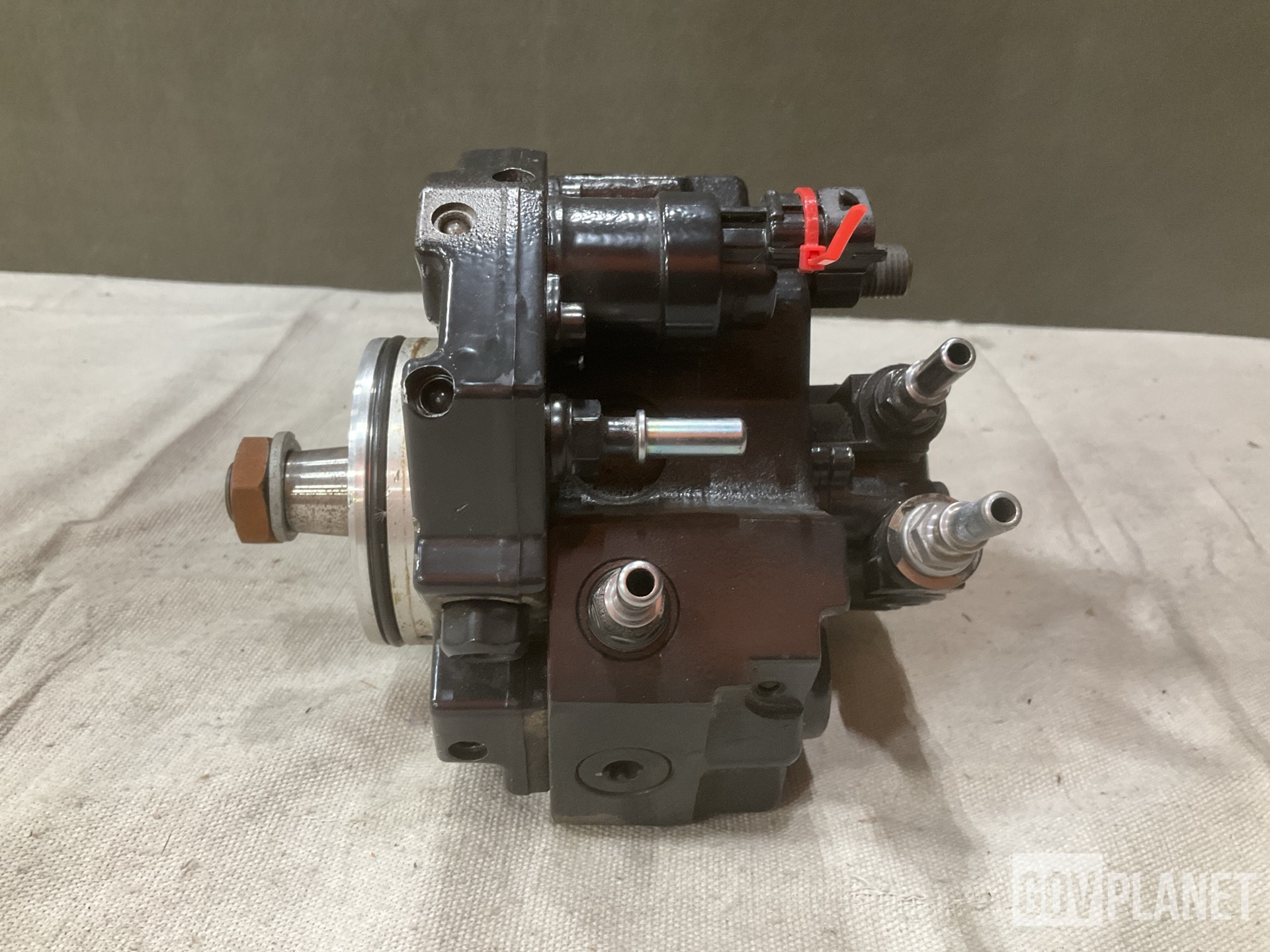 (1) Footrest, (1) Fuel Metering Pump & (18) Oil Filters & Assorted Items